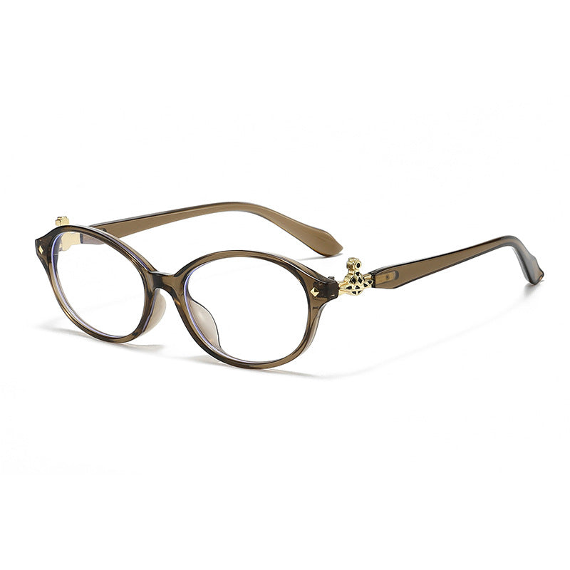 Dame motekunstig brille i elegant ova-design med gyldne aksenter Skanto