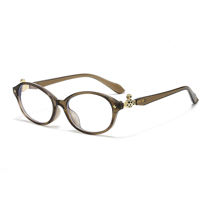 Dame motekunstig brille i elegant ova-design med gyldne aksenter Skanto