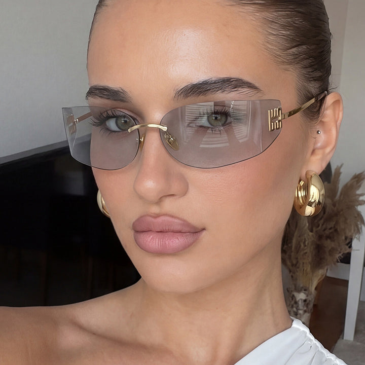 Dame futuristisk designer solbrille med uvanlig ramme og UV-beskyttelse Skanto