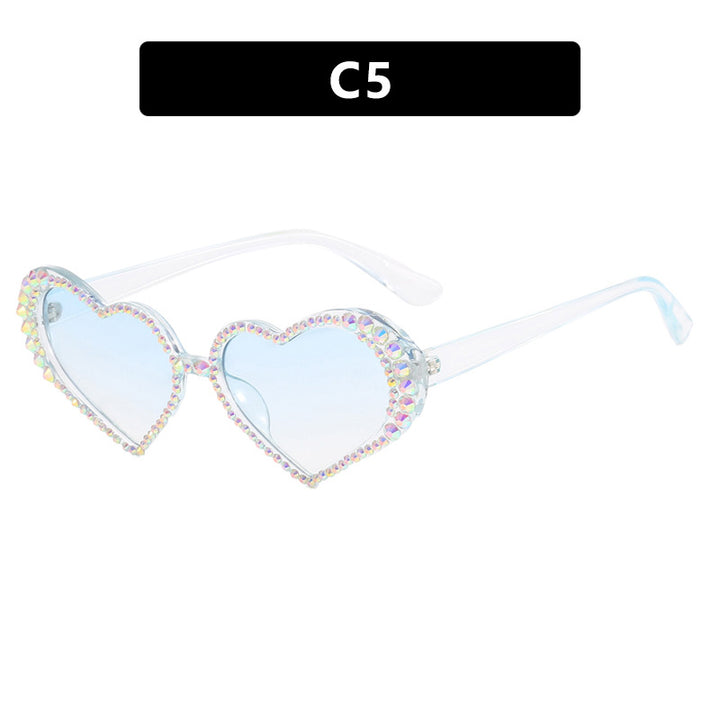 Dame hjerteformet solbrille med strassbesatt ramme Skanto