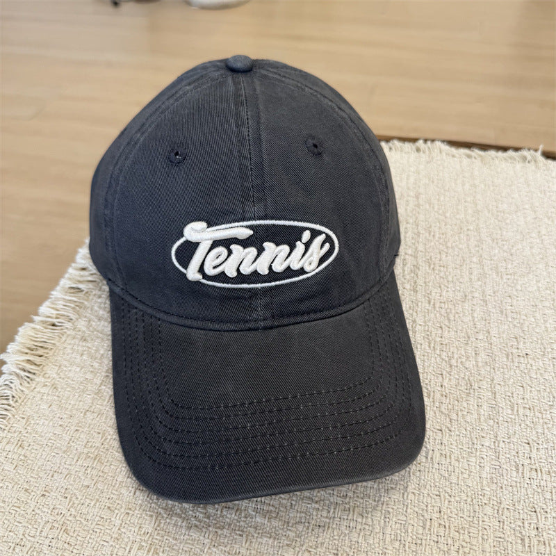 Herresportcaps med tennisgrafikk Skanto