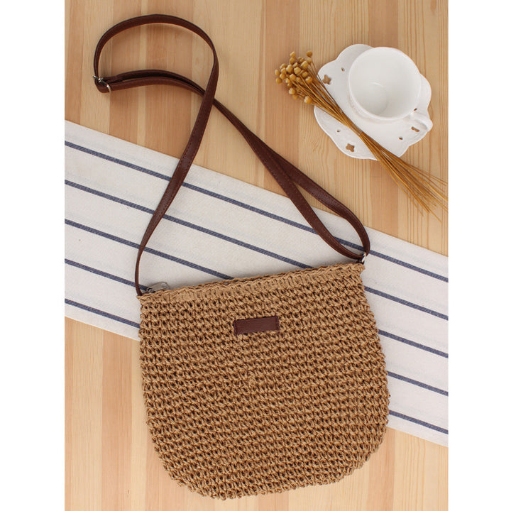 Shoulder bag in woven natural material with detachable leather strap Skanto