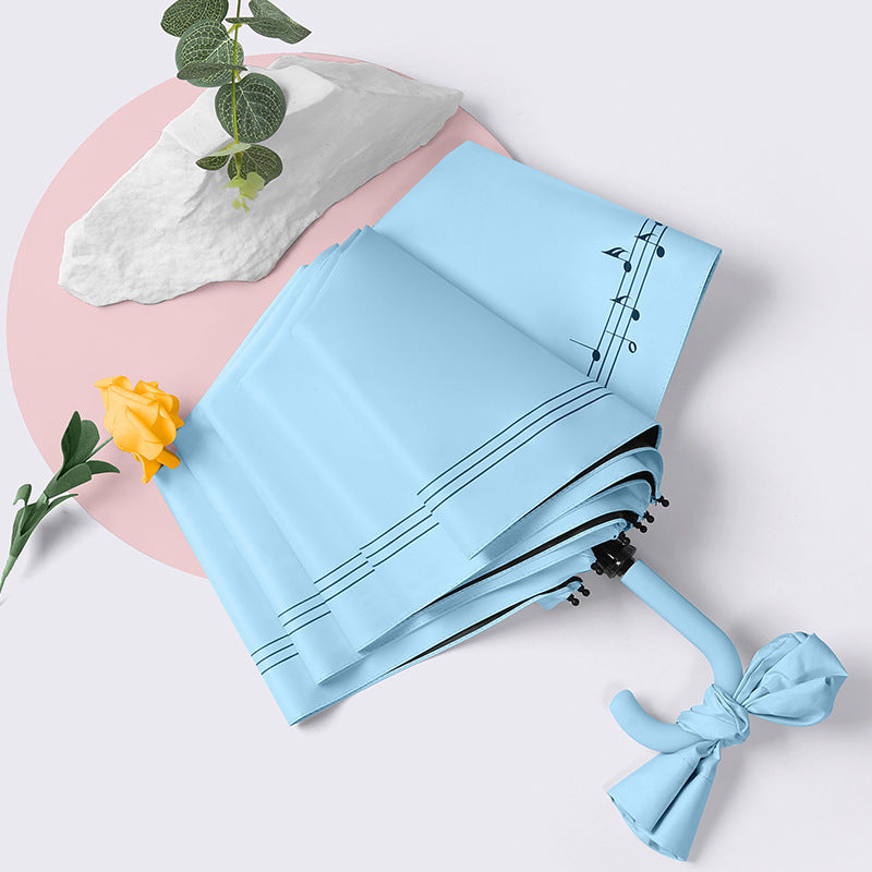 Dame elegant sammenleggbar paraply med hjerteformet design Skanto