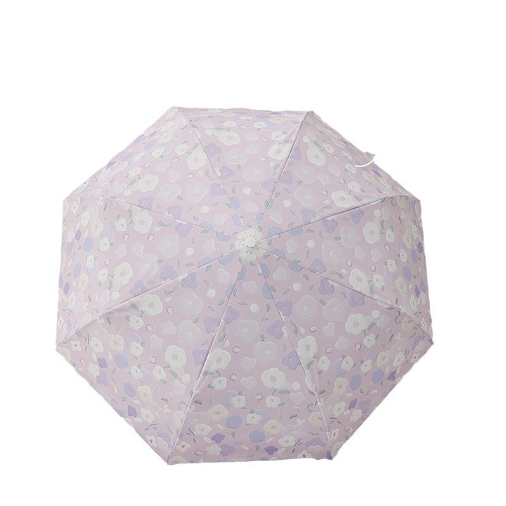 Dame sammenleggbar paraply med stilfullt blomstedesign Skanto