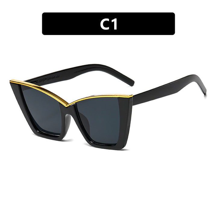 Dame ekstravagant solbrille med unik design og gullige aksenter Skanto