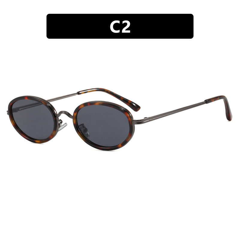 Dame elegant rund solbrille med moderne metallramme Skanto