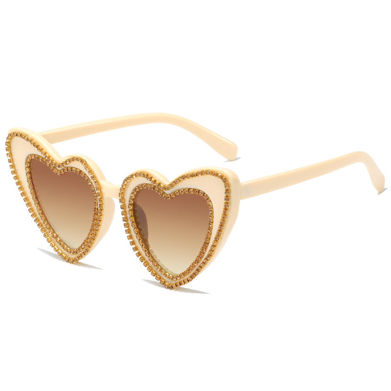 Dame hjerteformet solbrille med glitrende detaljer Skanto