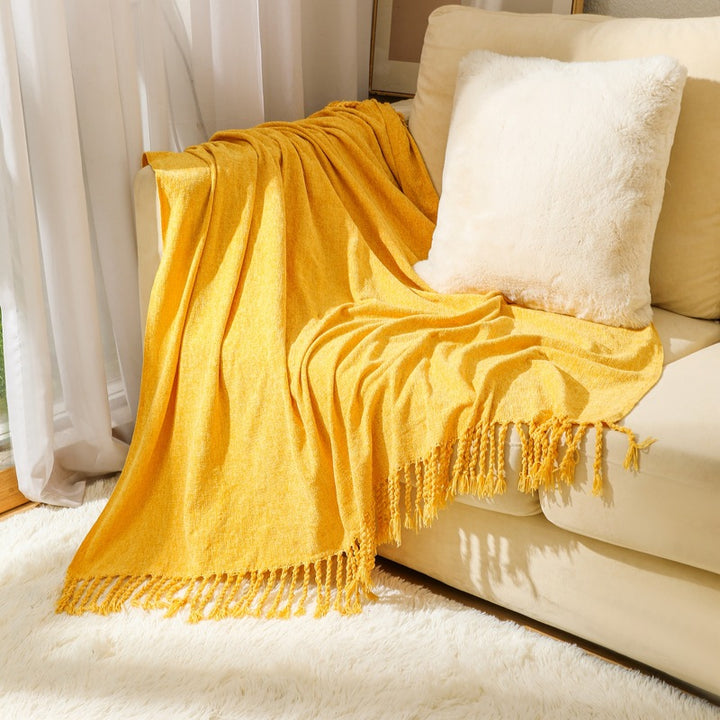 Kvinnelig elegant og stilfull sofa teppe med frynser Skanto