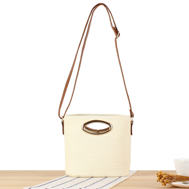 Handwoven natural material crossbody bag with elegant ring clasp Skanto