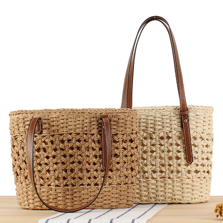 Handbag made of hand-woven straw with elegant faux leather handles Skanto