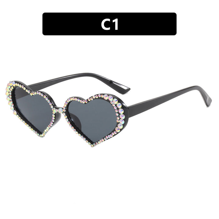 Dame hjerteformet solbrille med strassbesatt ramme Skanto