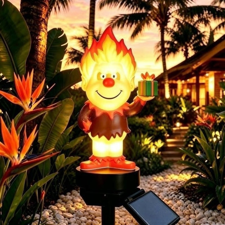 Solar-powered cartoon flame figure garden stake light with acrylic diffuser and adjustable ground spike Skanto