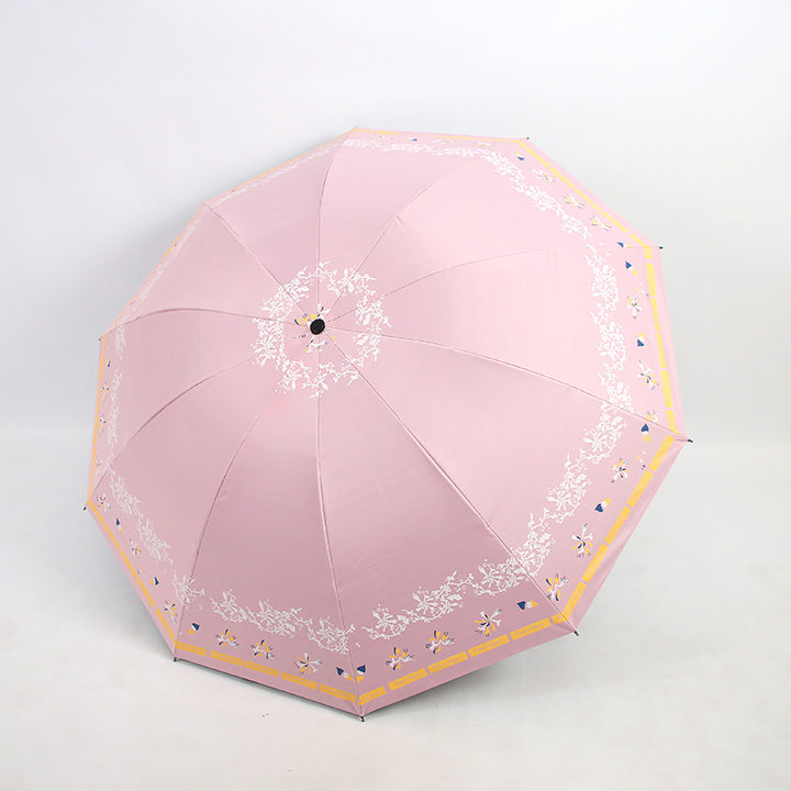 Kvinnens elegante sammenleggbare paraply med blomsterdesign Skanto