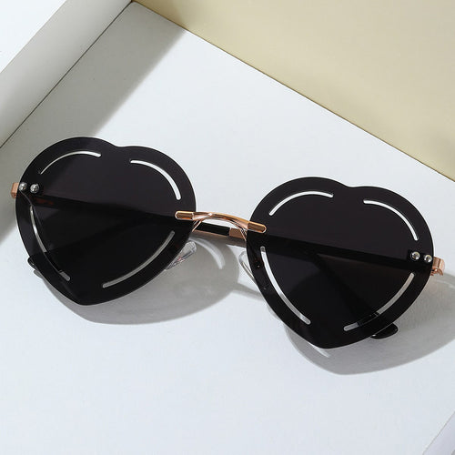 Damer hjerteformet solbrille med stilfull metallramme Skanto