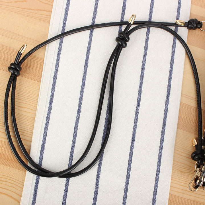 Shoulder bag made of hand-woven synthetic material with fashionable sliding mechanism Skanto