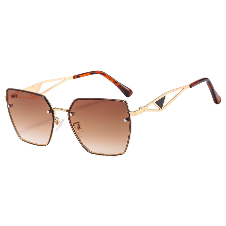 Dame geometrisk solbrille med filigran design Skanto