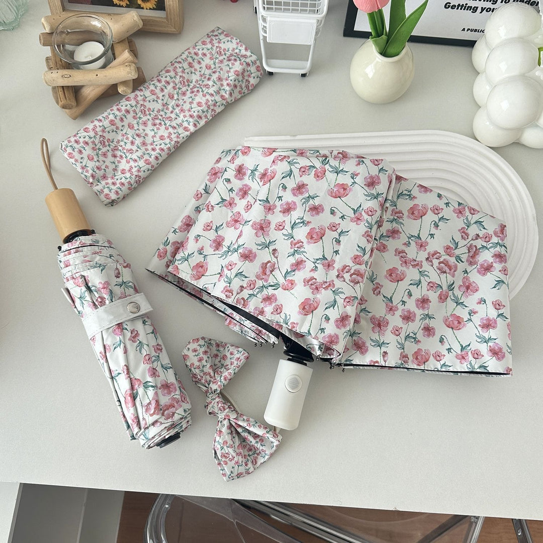Dame sammenleggbare paraply med blomsterdesign og praktisk oppbevaringssystem Skanto