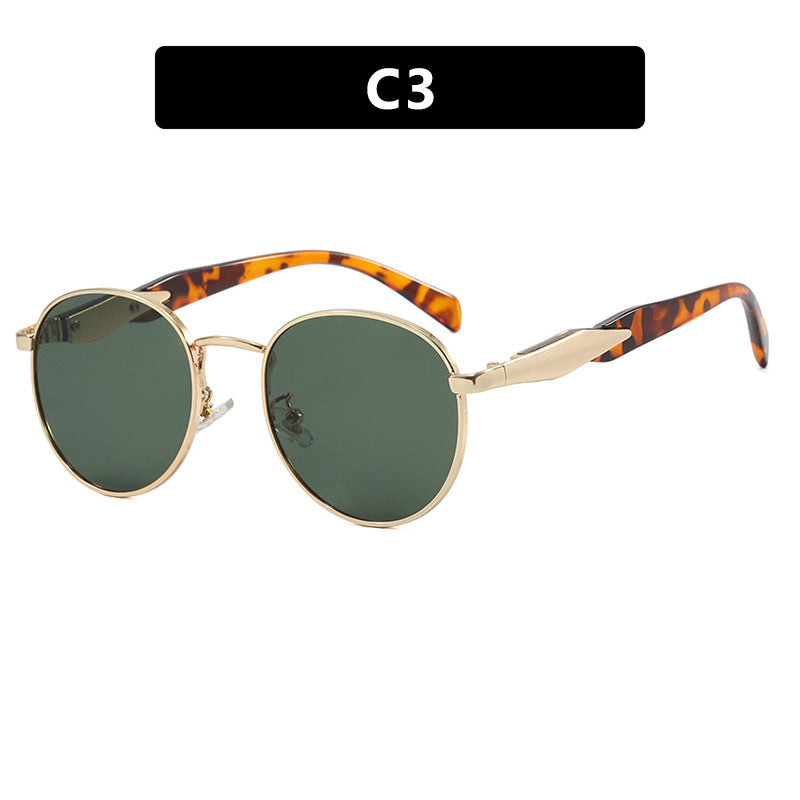 Dame rund solbrille med elegant, gullramme og UV-beskyttelse Skanto