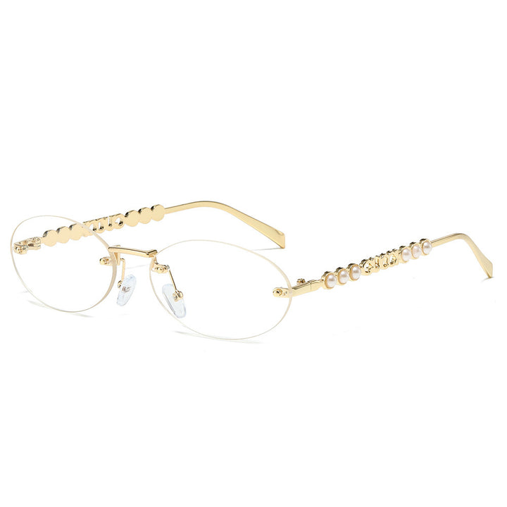 Dame moteriktig solbrille med oval ramme og perledekorert bøyle Skanto