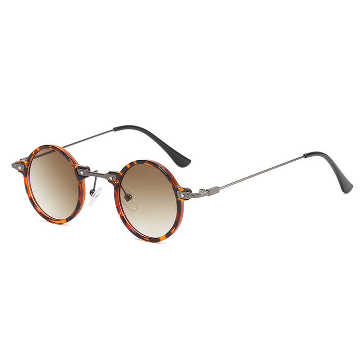 Dame rund solbrille med moderne metallramme og store blå linser Skanto