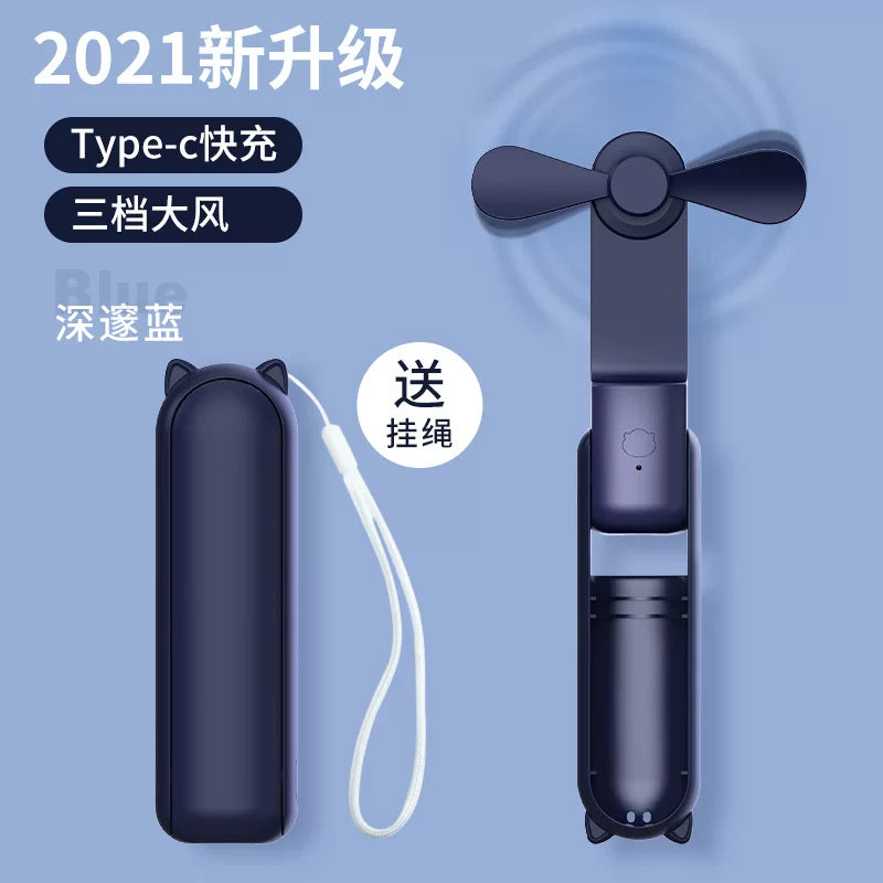 Unisex en størrelse sammenleggbar oppladbar trippel håndholdt mini vifte med innebygd powerbank USB-C og USB-A tilkoblinger samt håndleddsstropp Skanto