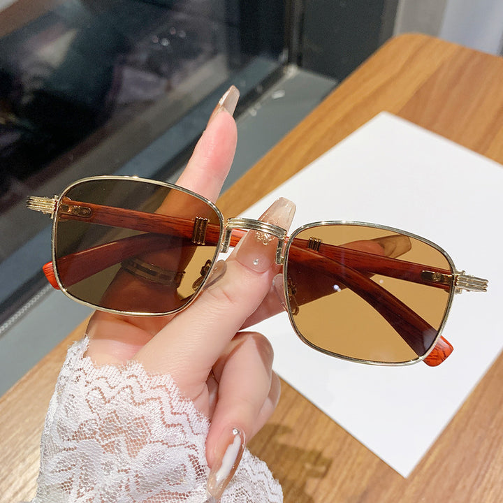 Dame solbrille med luksuriøs treinnfatning Skanto