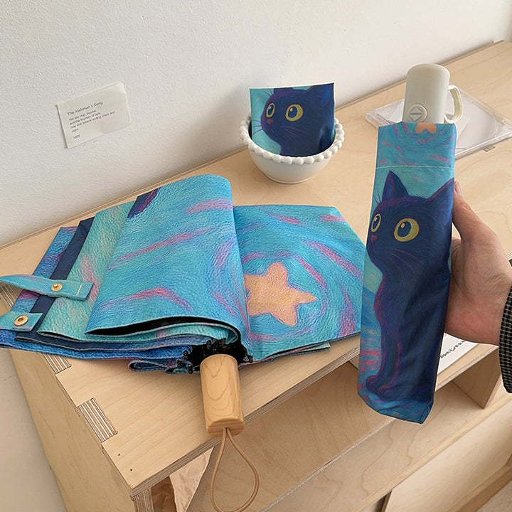 Dame sammenleggbart paraply med kreativt kattemotiv og praktisk etui Skanto
