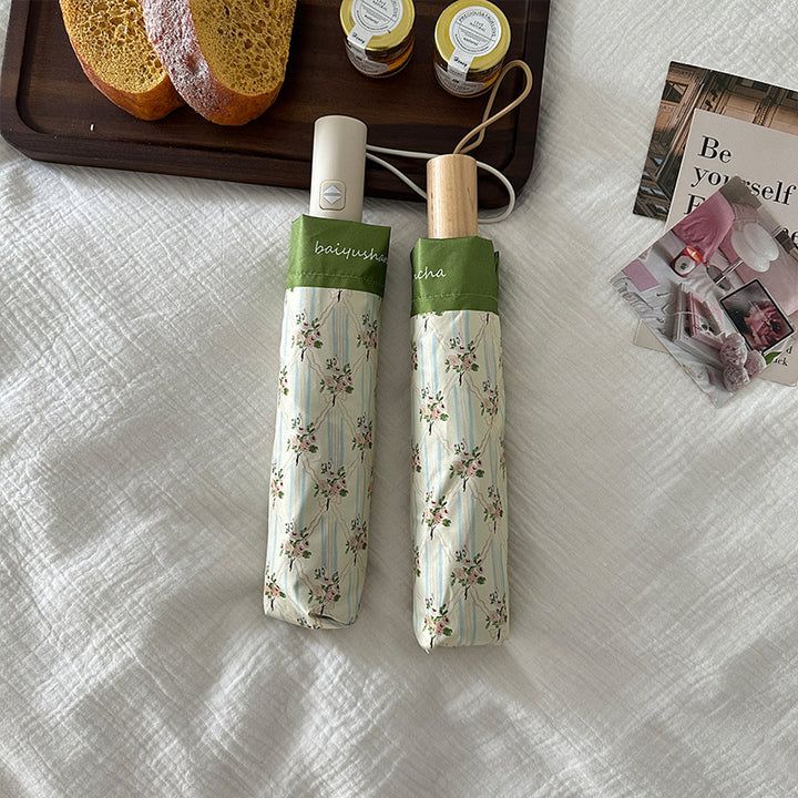 Dame elegant felle paraply med blomsterdesign Skanto