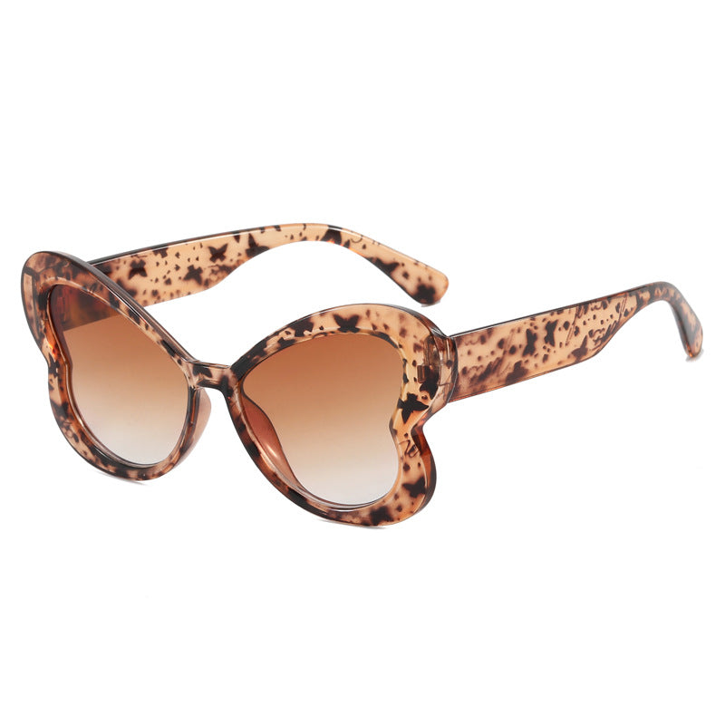 Dame Oversized-solbrille i leken sommerfugl-design Skanto