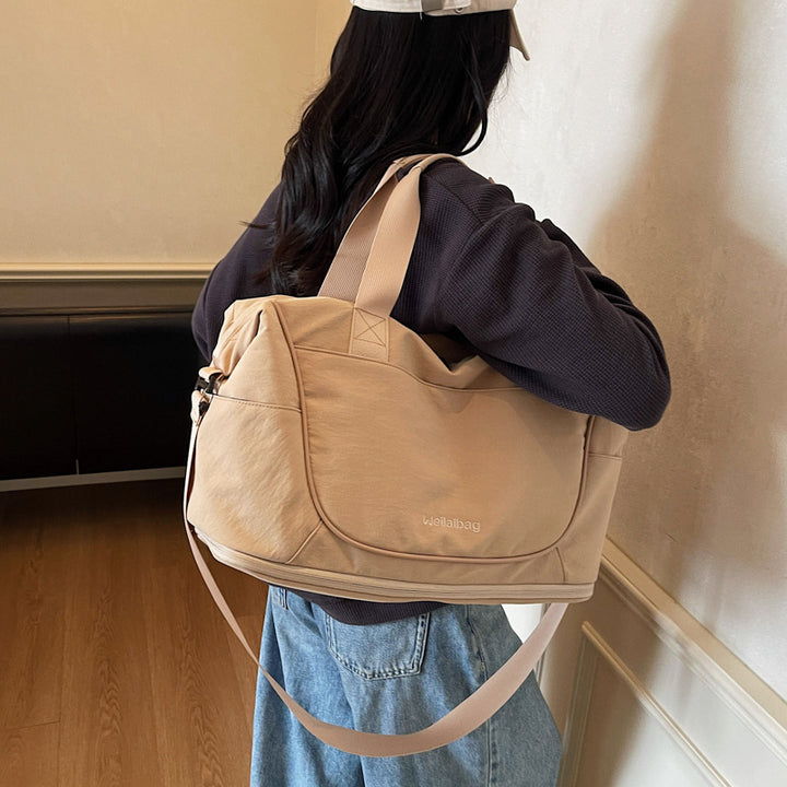 Damer Sporty Reiseduffel med romslig innvendig rom og justerbar skulderreim Skanto