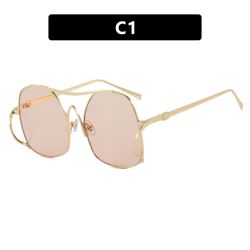 Dame geometrisk solbrille med smal metallramme og brune glass Skanto