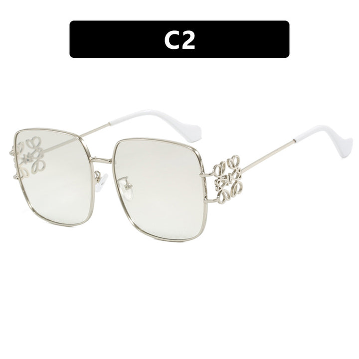 Dame kvadratisk solbrille med filigran design og luksuriøs metallramme Skanto