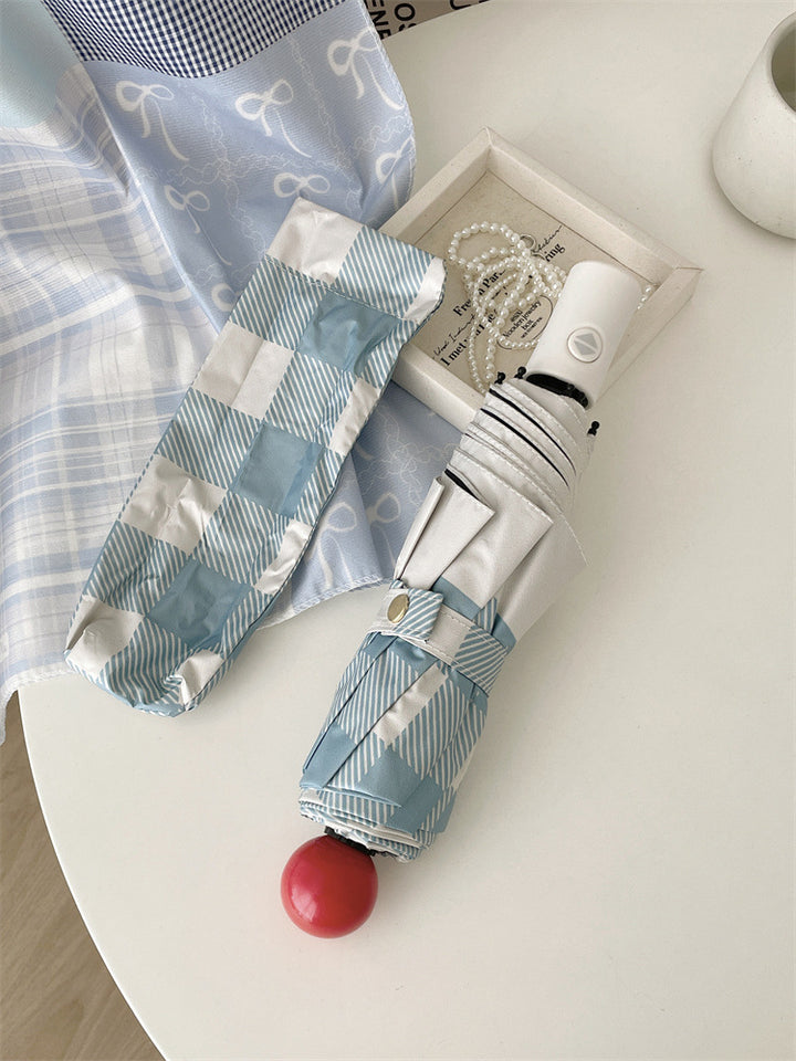 Dame sammenleggbart paraply med spesiell design Skanto