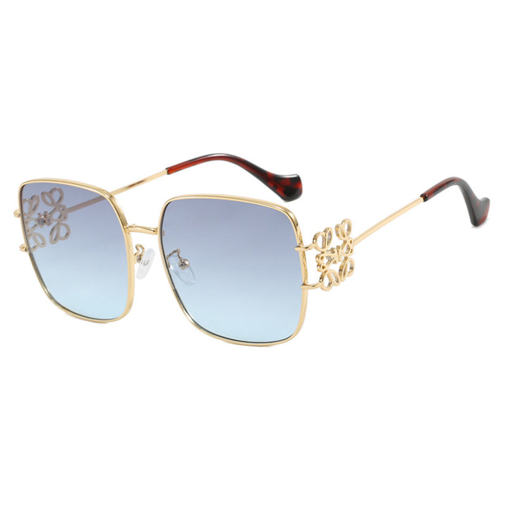 Dame kvadratisk solbrille med filigran design og luksuriøs metallramme Skanto
