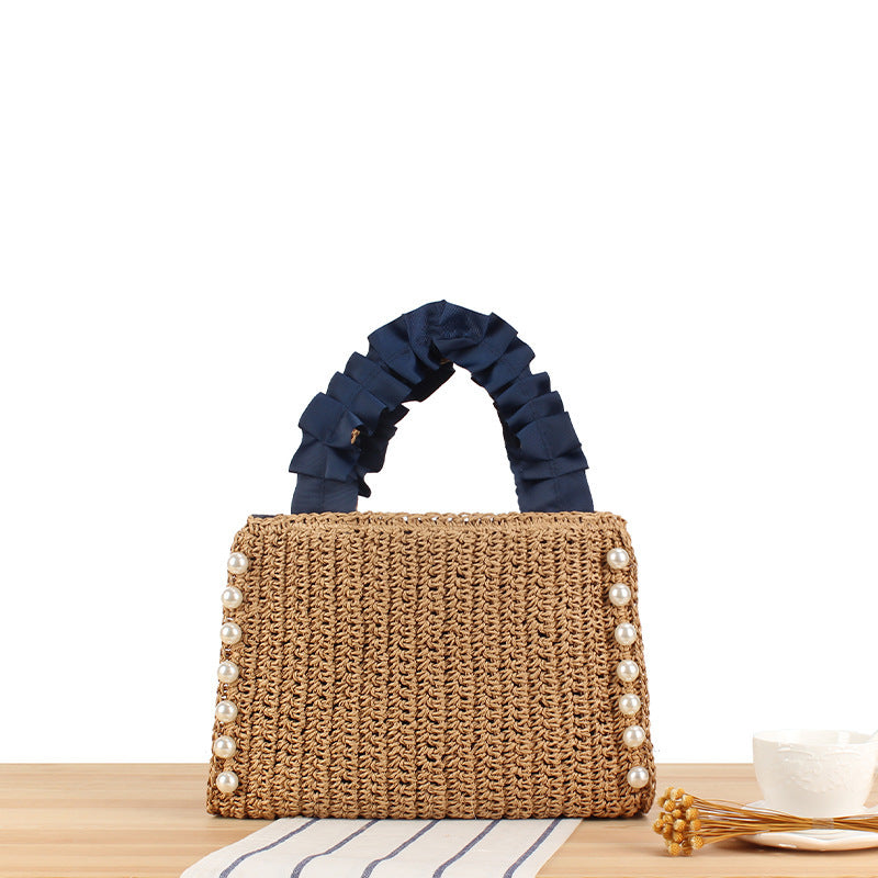Elegant handbag with beaded decoration and ruffled handle Skanto