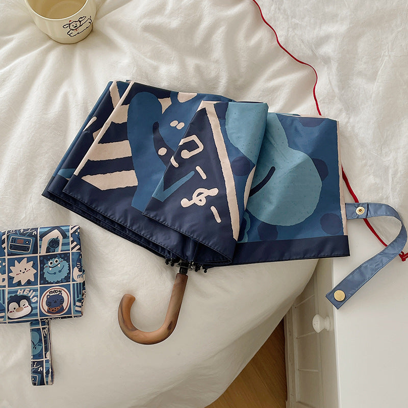 Dame sammenleggbare paraply med kreativt geometrisk design Skanto