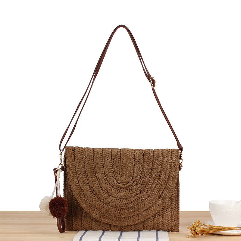 Woven natural material shoulder bag with original wave pattern Skanto