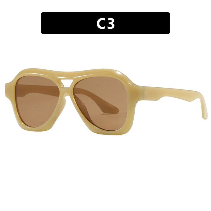 Dame moterik solbrille i innovativ design med bred ramme Skanto
