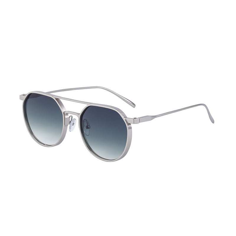 Dame moterik solbrille i stilfullt rundt design Skanto