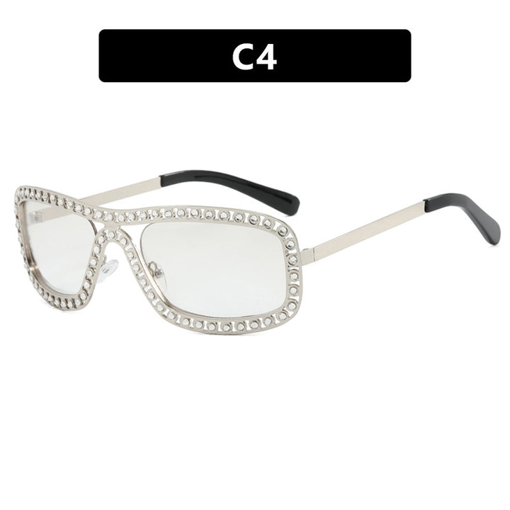 Dame moteriktig solbrille med glitrende ramme Skanto