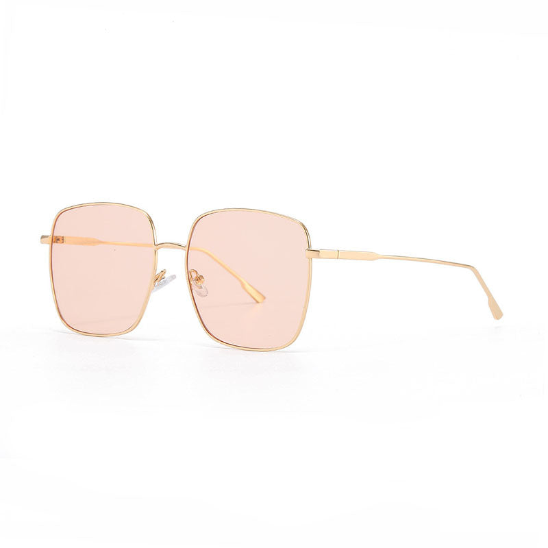 Dame solbrille med moderne firkantet rustfritt stålramme og polarisert glass Skanto