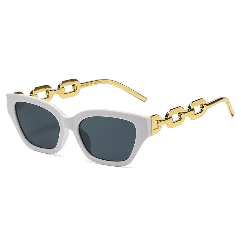 Dame Cat-Eye solbrille med dekorativ kjettingramme Skanto
