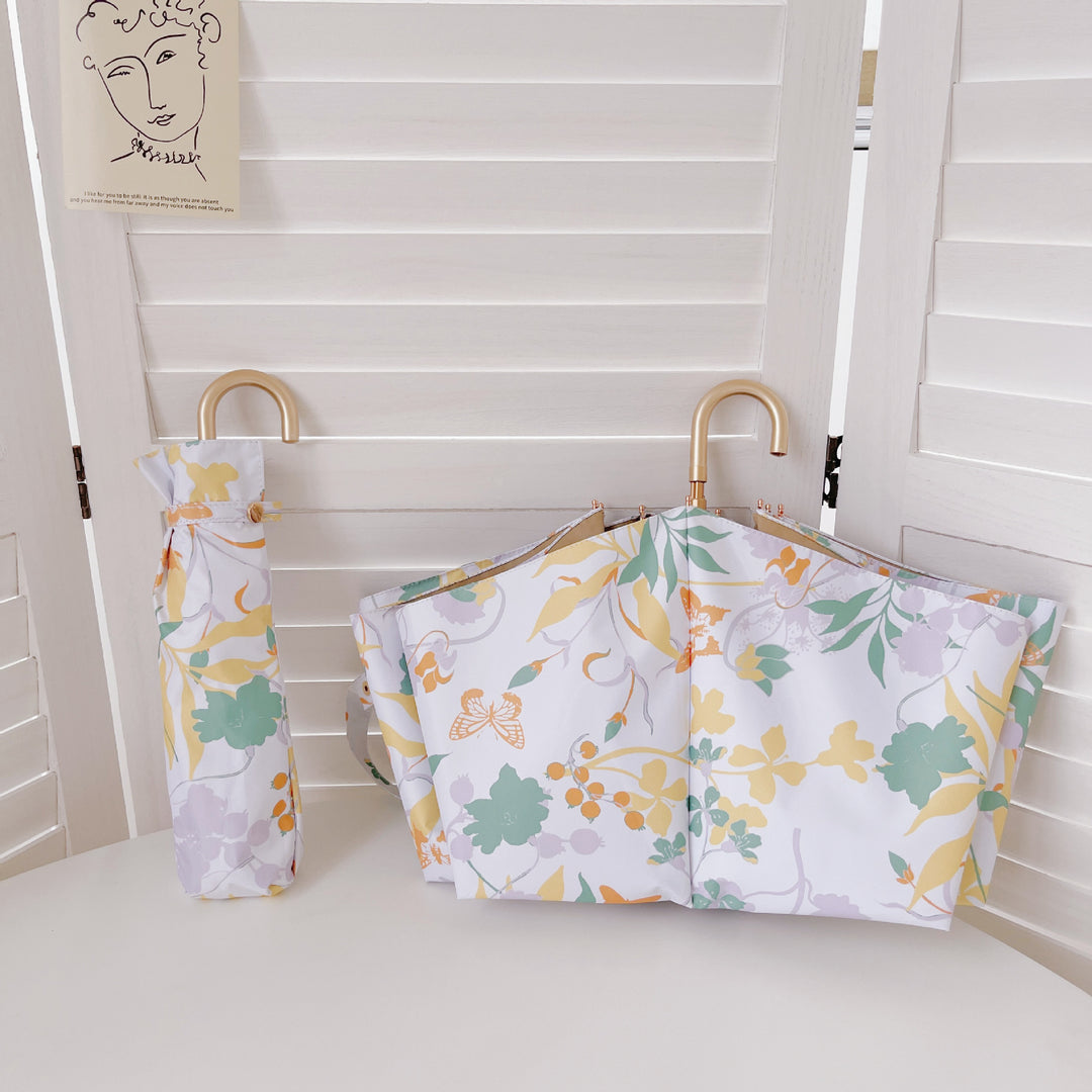 Dame elegant sammenleggbar paraply med hjerteformet design Skanto