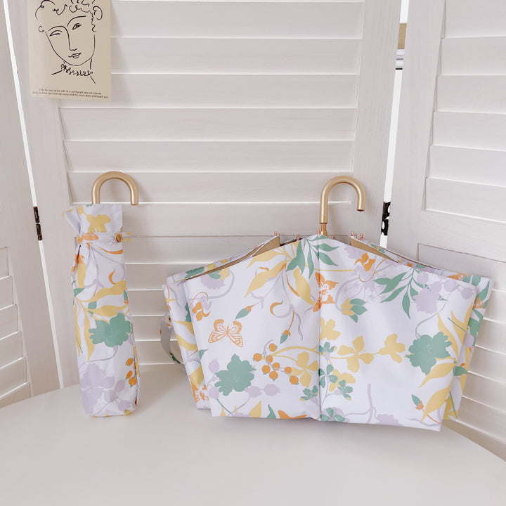 Dame elegant sammenleggbar paraply med hjerteformet design Skanto