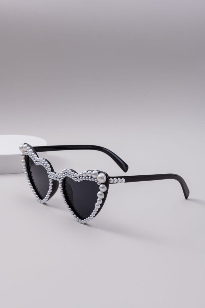 Dame designer solbrille med perleinnramming fra Skanto