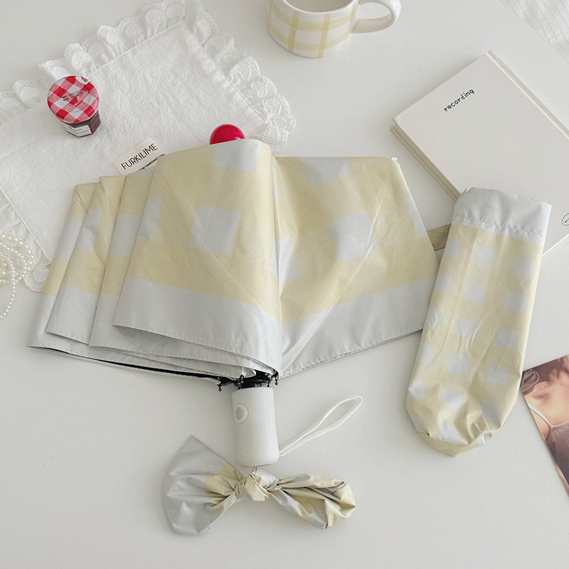 Dame sammenleggbart paraply med spesiell design Skanto