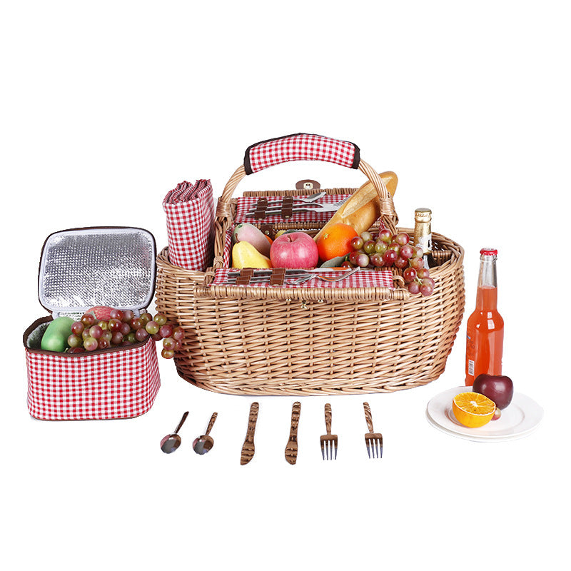 Kvinnes piknikkurv med elegant serviset Skanto