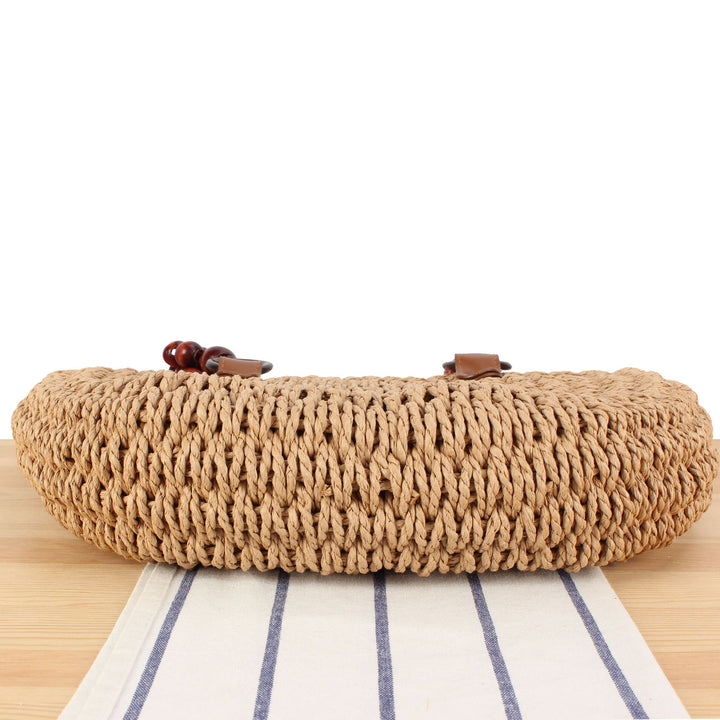 Basket bag with elegant wooden handles and textured surface Skanto