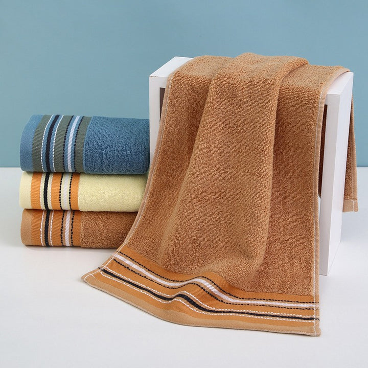 Premium terry towel with elegant stripe border.