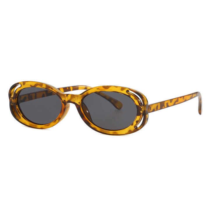 Damen modische solbrille med oval ramme og unikt design Skanto